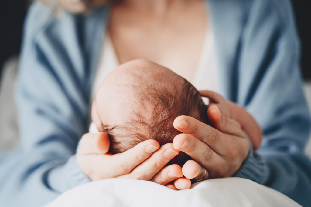 Newborn in mother's hands. Baby care. Childbirth and motherhood concept. Mother and baby Newborn in mother's hands. Baby care. Childbirth and motherhood concept. Mother and baby